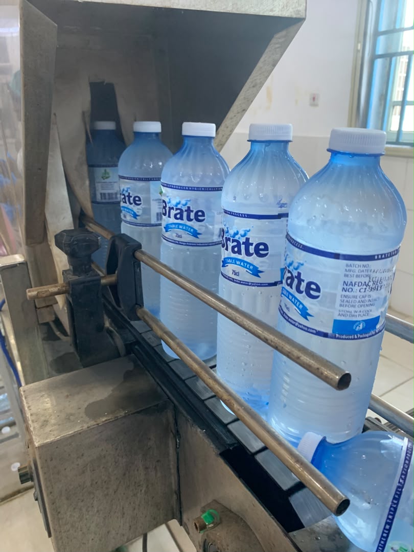 Brate Table Water bottling line, bottles moving through the automated filling station