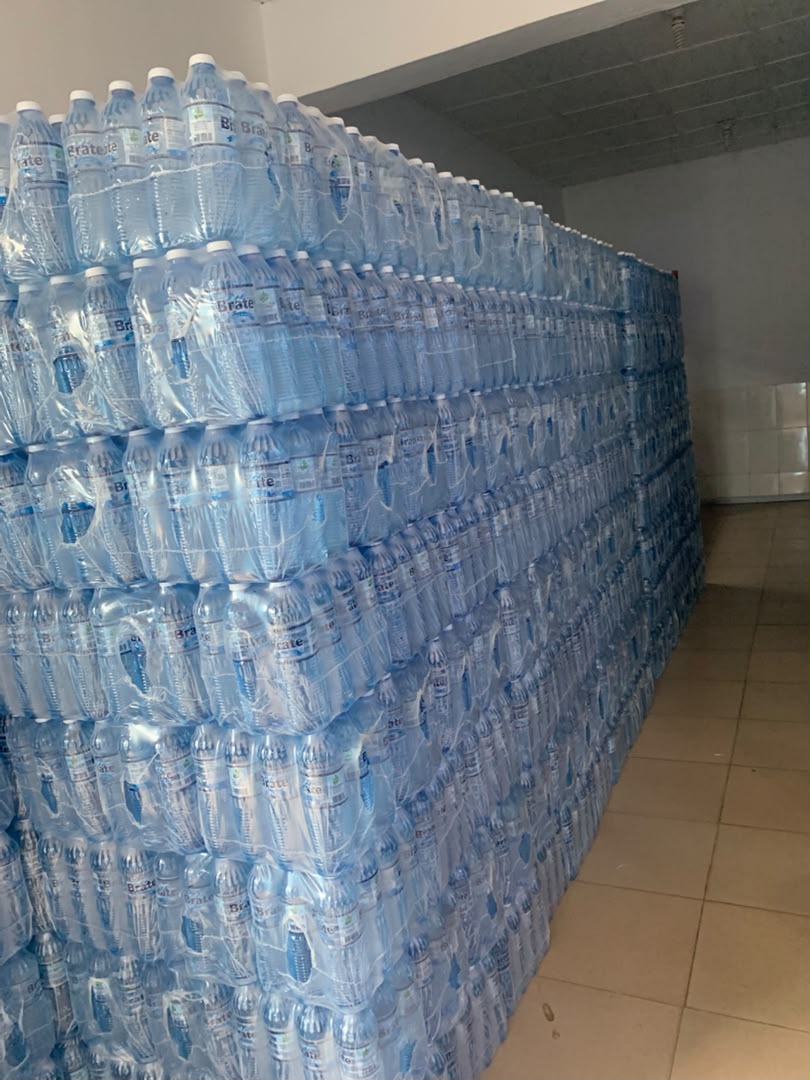 Warehouse of shrink-wrapped Brate 75cl bottle packs ready for dispatch